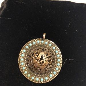 Genuine Sterling silver and turquoise pendant.
